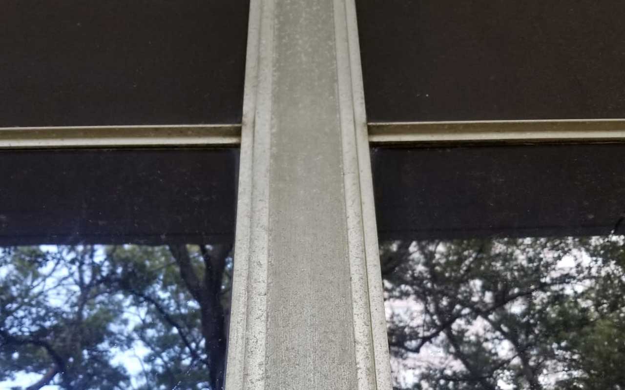 before photo of anodized aluminum window frame restoration