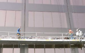 Best Commercial Waterproofing Services in process on glass and metal building